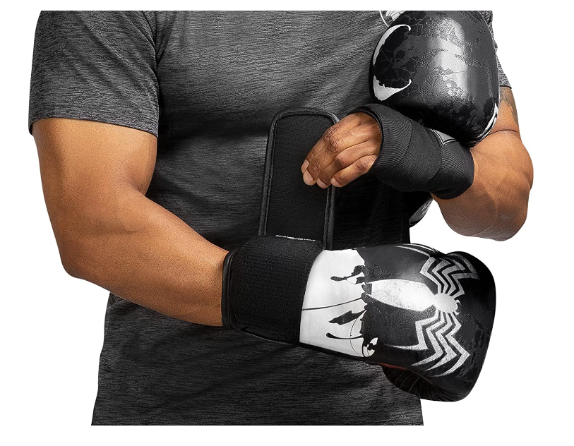 Man putting on Hayabusa marvel elite boxing gloves spiderman series