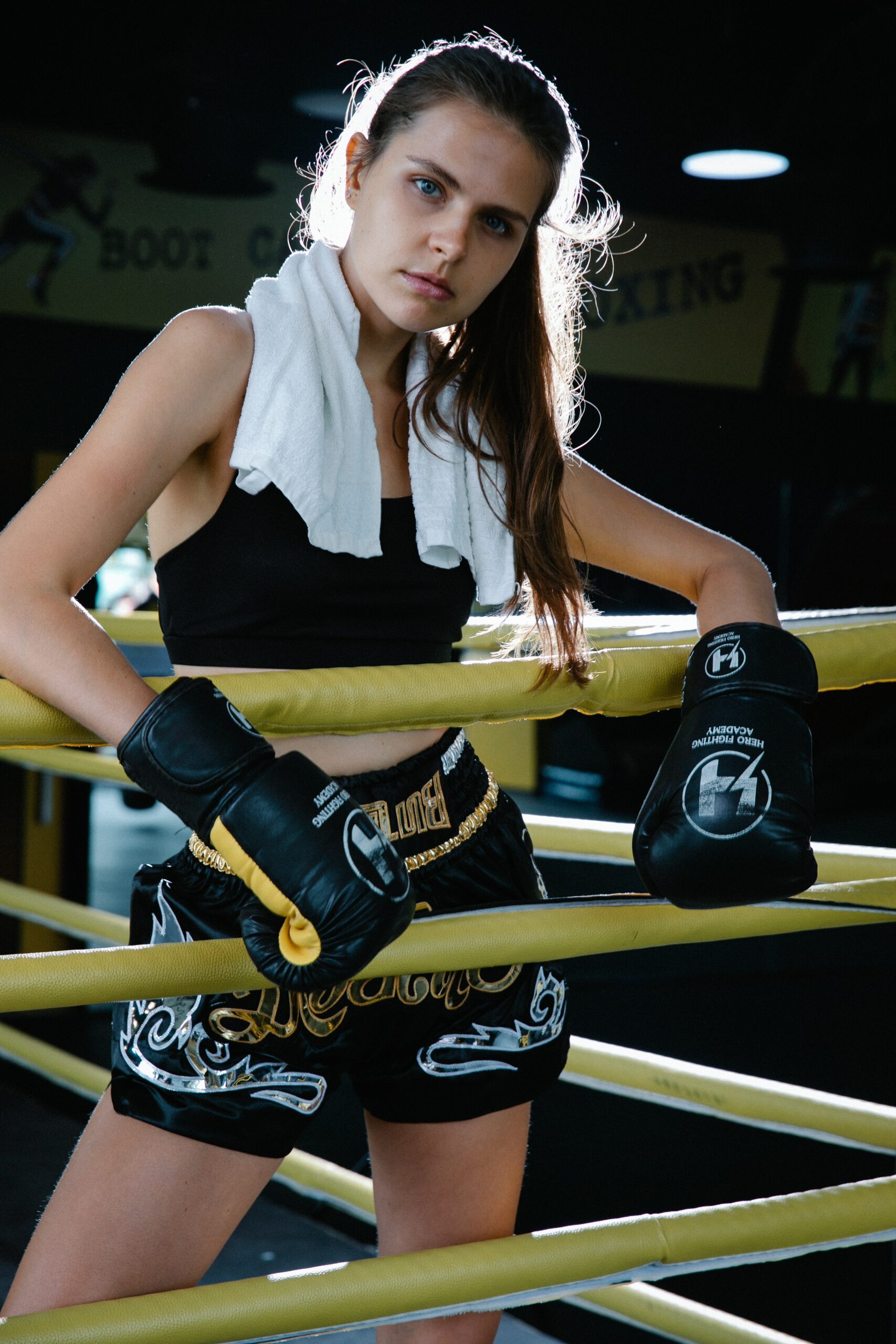 boxer posing in the ring with her boxing shorts